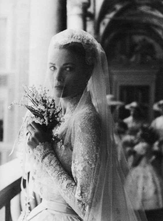 Grace Kelly on the day of her wedding to Prince Rainier of Monaco, holding bouquet of lilies of the valley