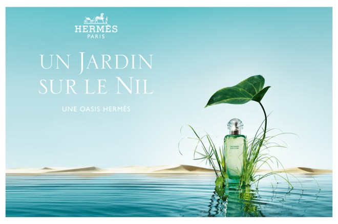 Advertisement for Hermes Un Jardin Sur le Nil, bottle of perfume resting on lotus leaf against background of Nile River