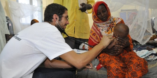 Doctors Without Borders (Medecins Sans Frontieres), treating refugee mother and baby in Africa