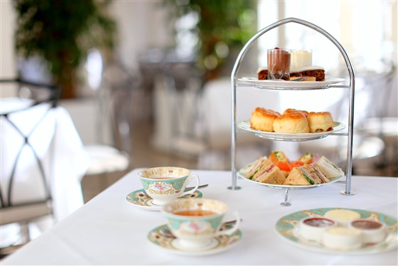 Afternoon tea setting with cakes at Kensington Palace, The Orangery, London