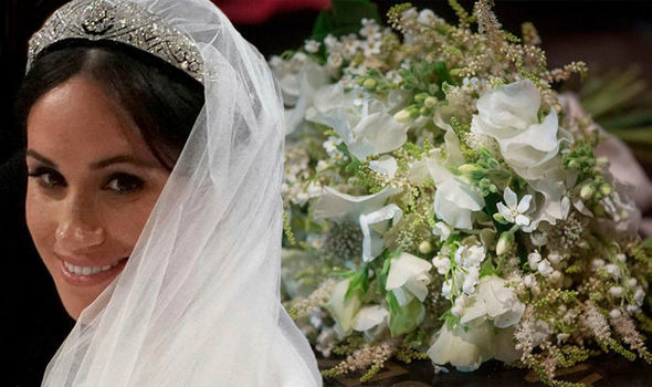 Meghan Markle and her wedding bouquet of white flowers