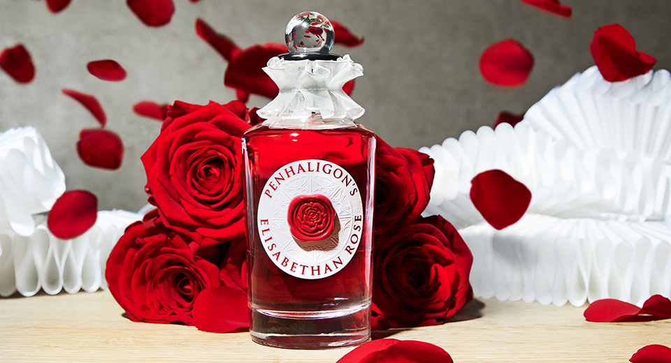 Bottle of Penhaligon's Elisabethan Rose eau de parfum with roses
