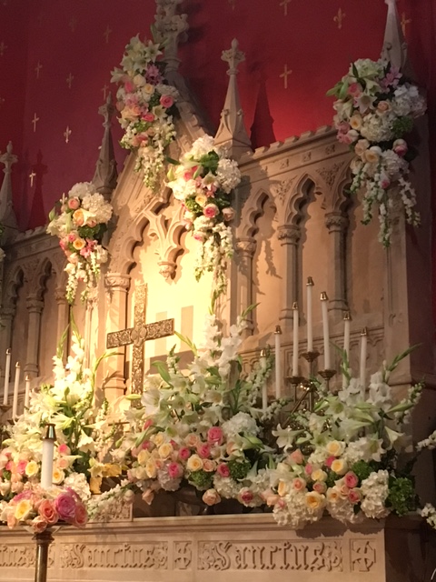 Altar and reredos with flowers for Easter Sunday