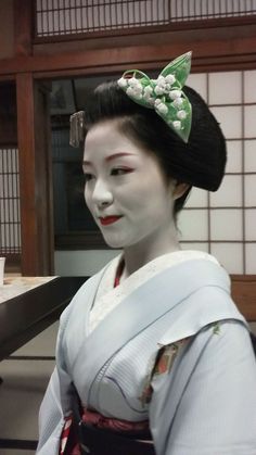 Japanese woman wearing traditional garb with lily of the valley headpiece