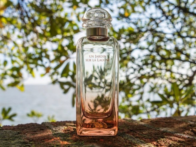 Bottle of Hermes fragrance Un Jardin Sur La Lagune in Venetian landscape
