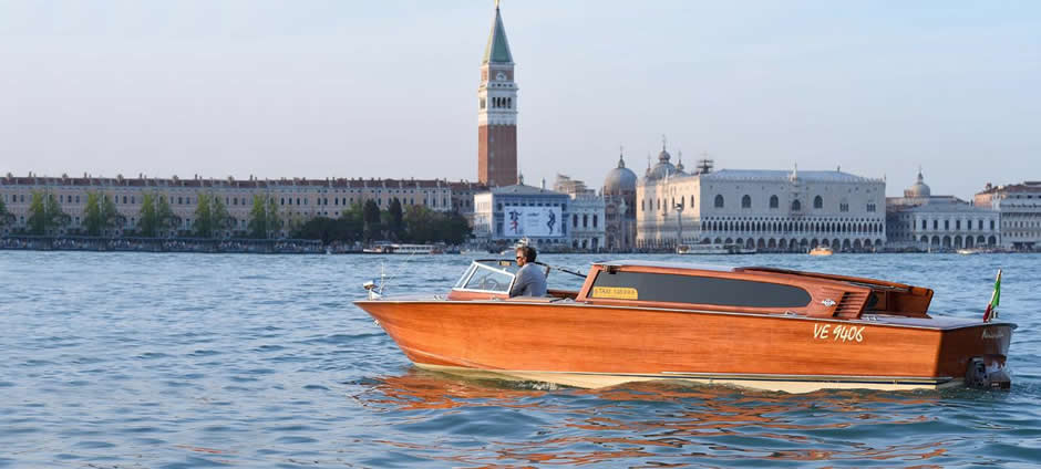 Wooden water taxi in Venice lagoon landscape