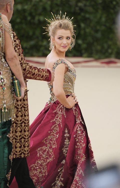 Actress Blake Lively in red velvet Versace gown.