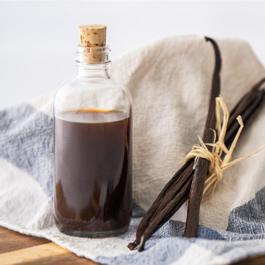 Bottle of Bourbon vanilla extract with vanilla bean pods