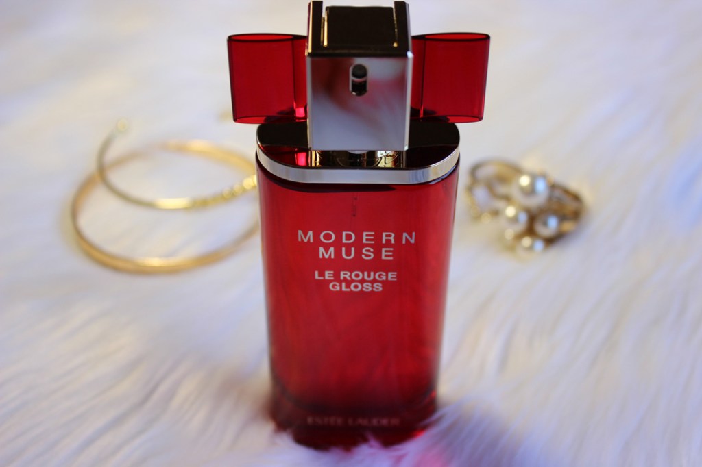 Red bottle of Estee Lauder's fragrance Modern Muse Le Rouge Gloss