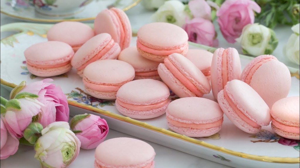 Pile of pink macarons with flowers